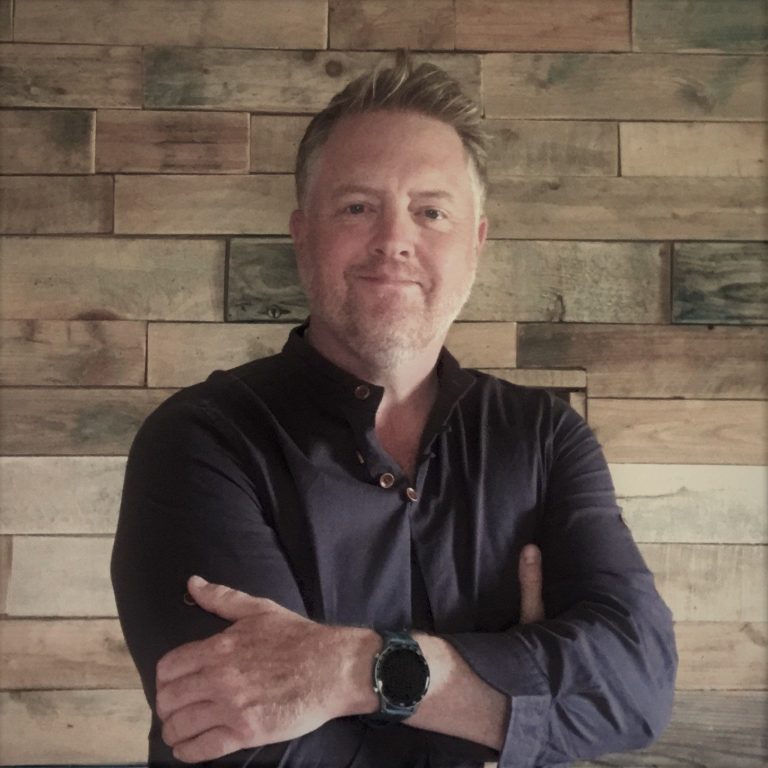 Evening Storm over Vixen Tor, Dartmoor. An atmospheric oil painting of Dartmoor with a storm passing over Vixen Tor in the evening light by renowned Dartmoor artist Tim Yorke-Dunne